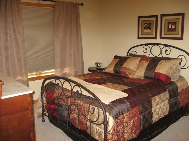 Bedroom with carpeting.