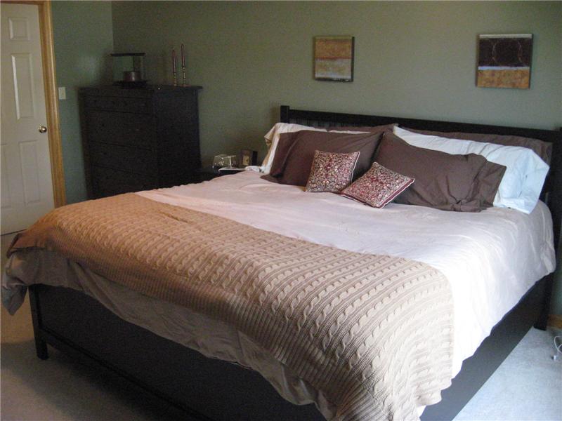 Master bedroom with carpeting.