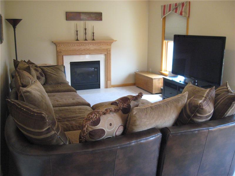 Family room with carpeting.