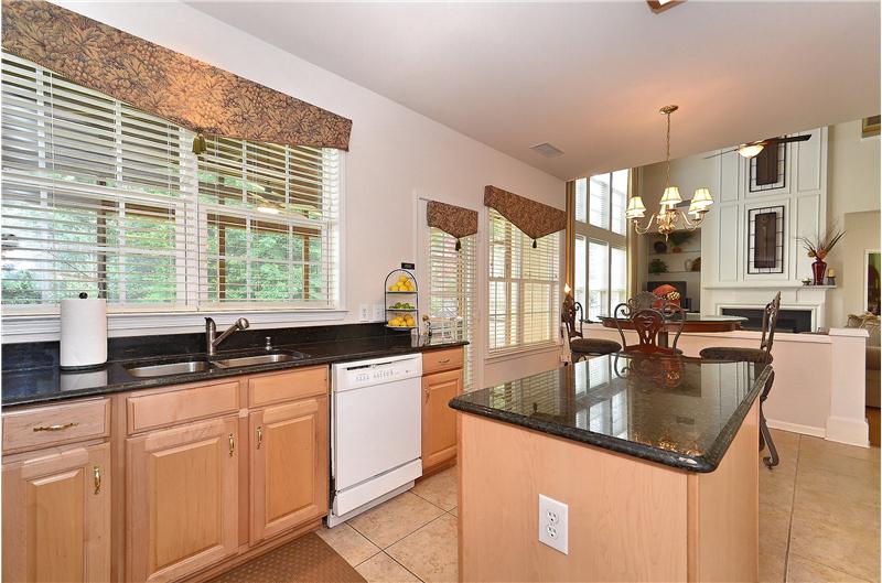 Kitchen has plenty of granite counter space and 42inch cabinetry