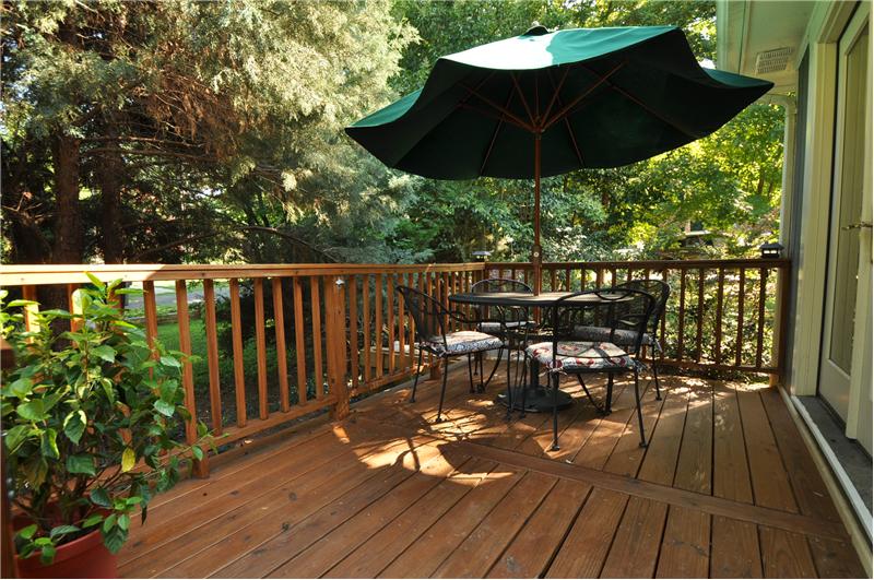 Beautiful wood deck is a great place for entertaining your guests