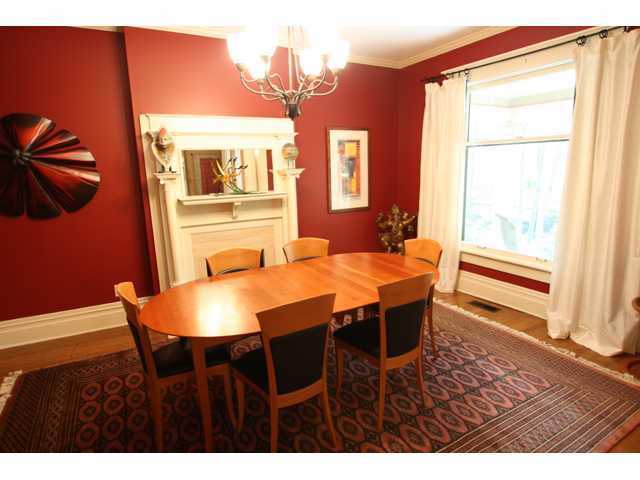 Holiday size dining room with gleaming hardwood floors