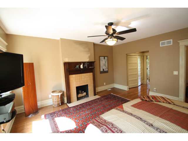 Large owner suite with sitting area, gas log fireplace, 2nd floor laundry and luxury bath