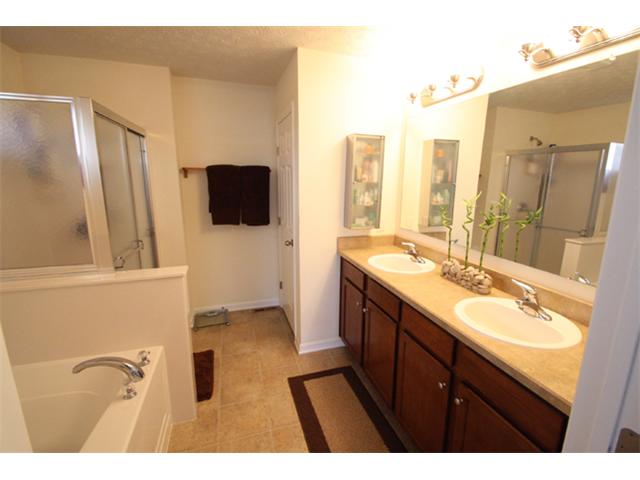 spacious master bath with tub and shower