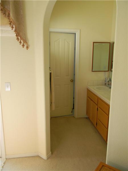 The toilet and shower have a separate area through the door