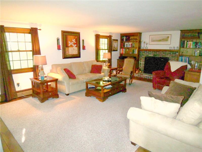 Enormous Front to Back LR features Hardwood Floors and Beautiful Fireplace