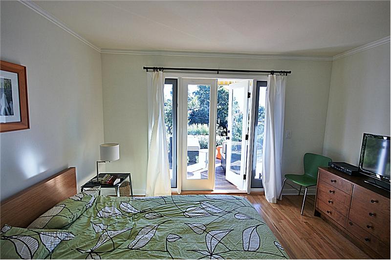 Master bedroom with door to deck
