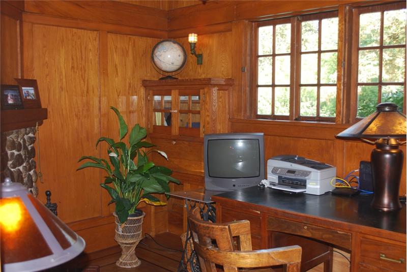 Study with Built In Book Shelves & Wood Paneling