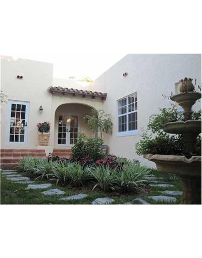 Fully landscaped backyard with foundtain and lily pond