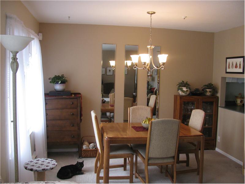 Dining room with window opening to kitchen