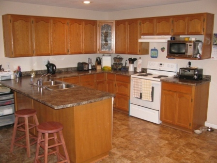 Kitchen with oak cabinets and eating area