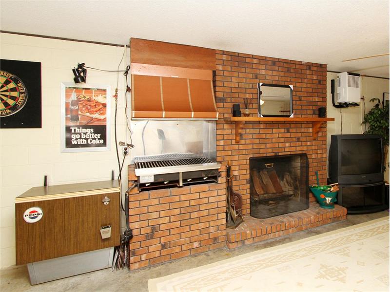 YES THAT IS A GRILL AND FIREPLACE IN THE BASEMENT